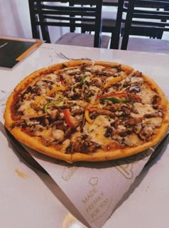 Pizza photographed at Aashi's Bistro